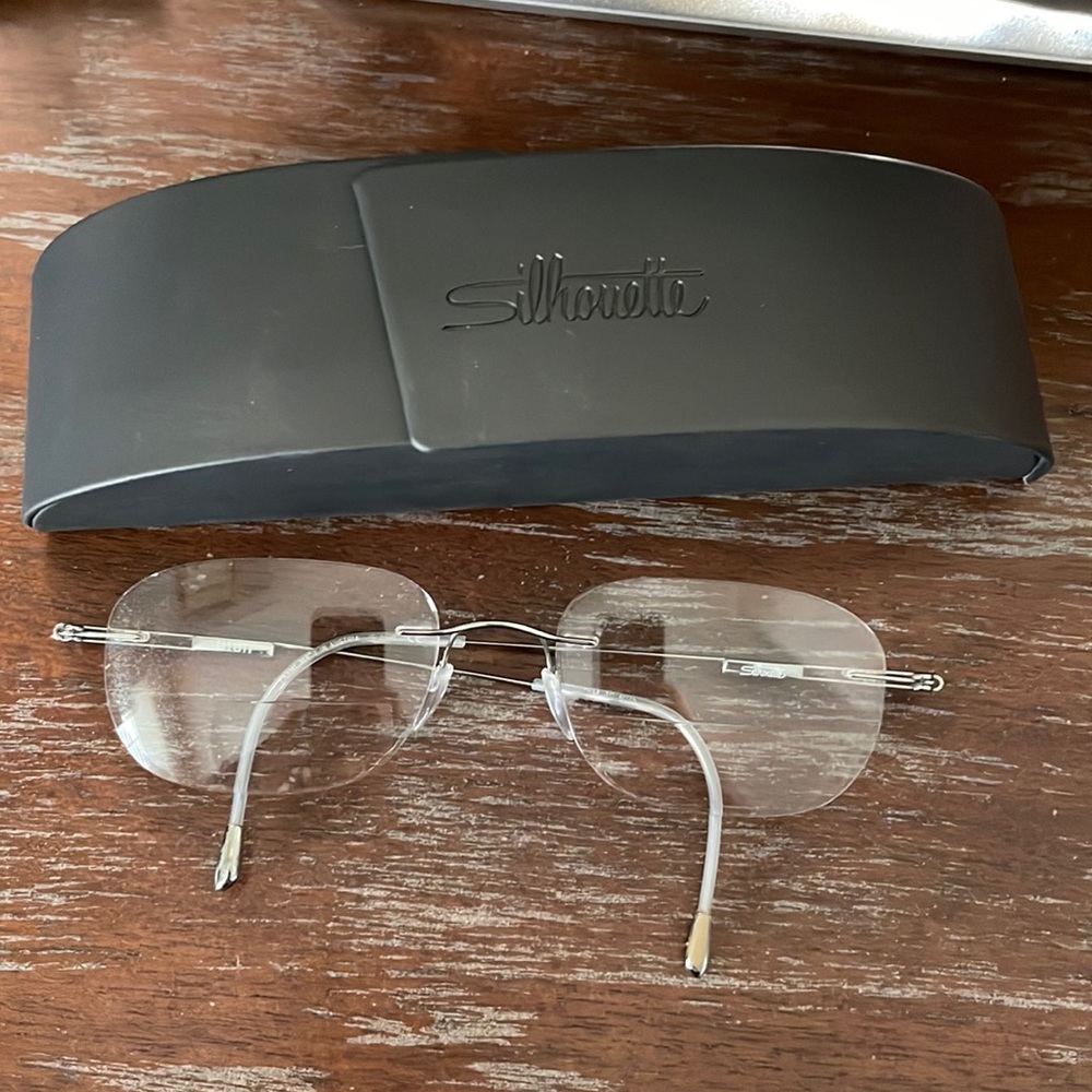 Titan 7534 10 6075 silver metallic rimless eyeglasses with case
